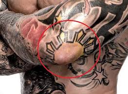 His has a big mashup of different styles of tattoos with a. Dave Bautista S 33 Tattoos Their Meanings Body Art Guru