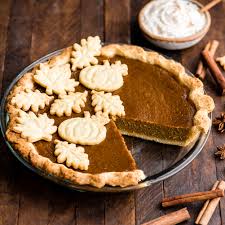 overhead front view of a dairy free pumpkin pie in a gl pie dish with
