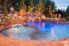 Fiberglass swimming pool water features: Why Add Waterfalls To Your Swimming Pool Design