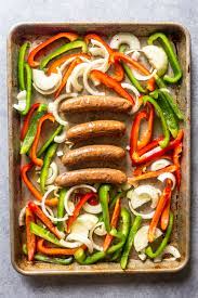 A healthy and delicious sheet pan meal using chicken sausage, peppers, onion, and spaghetti squash in lieu of pasta. Sausage Peppers And Onions Sheet Pan Dinner