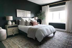 dark green guest room with boho style