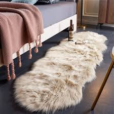 faux leather area rug in beige