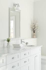 White Bathroom With Marble Backsplash