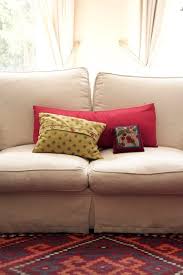 a sagging couch with attached cushions