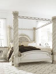 King sleigh bed, dresser with mirror and two nightstands, a rich traditional design and exquisite details come together to create the ultimate in the grand style of the north shore bedroom collection. Cassimore North Shore Pearl Silver King Upholstered Poster Canopy Bed