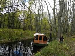 man designs micro houseboat you can