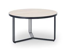 It has a smooth, brown laminate top and black metal, open frame legs. Finn Small Circular Coffee Table Pale Oak Top Black Frame