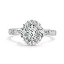 Many people choose to buy their center stone separately from the mounting. Round Diamond Oval Halo Design Engagement Ring Frassanito Jewelers
