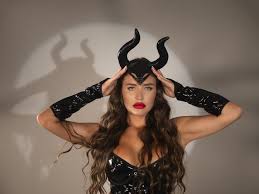 woman adjusting devil horns on head