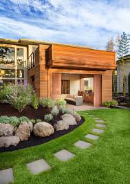 The rocks help hold back the extra soil needed to create the patio and the mulch keeps soil erosion under control. Landscape Rock Design For Your Glendale Home