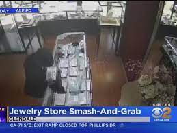 man shatters jewelry cases with