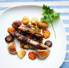 flank steak with roasted vegetables in