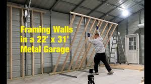 framing walls inside a metal garage