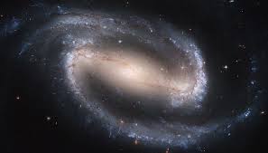 Sin embargo, parece estar formando estrellas a mayor ritmo que nuestra galaxia. Barred Spiral Galaxy Ngc 2608 Surrounded By Many Many Other Galaxies Universe Today