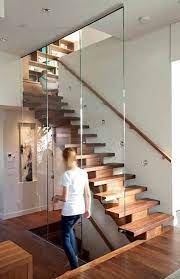 modern wood stairs glass railing wall