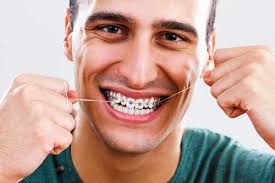Carefully thread it under or over the main wire of your braces, taking care not to get it stuck. Ways To Floss With Braces