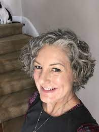 Light brown fresh curls make a frame for the forehead in this short hairstyle for a mature face. How To Grow Out A Pixie Gracefully Grey Curly Hair Curly Hair Styles Hair Styles