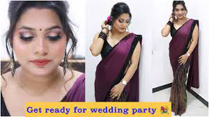 wedding makeup with purple saree