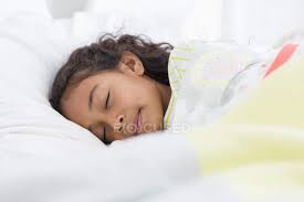 cute little girl sleeping on bed pre