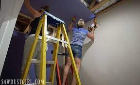 Flood Installing Purple Xp Drywall