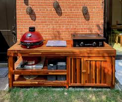 wood table with built in grill storage