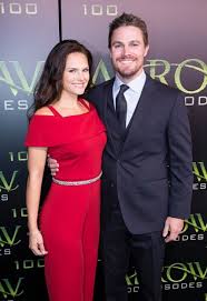 Short description of stephen amell: Stephen Amell His Wife Cassandra Jean Arrive On The Green Carpet For The Celebration Of The 100th Episode Of Cw S Arrow On O Stephen Amell Celebrities Celebs