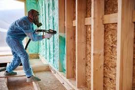 Male Builder Insulating Wooden Frame