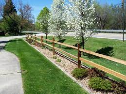 Cedar is installed for the round rail fences. Pin By Liz Gaden On Yard Garden Fence Landscaping Driveway Landscaping Backyard Fences