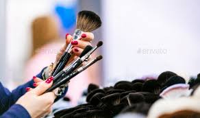 customer woman choosing makeup brushes