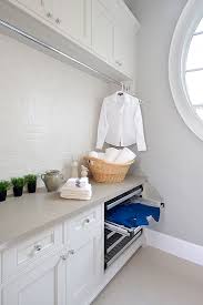 If you have sufficient place on the wall, then you can hang a rack hang the wet garments on it to let it dry. Laundry Rooms Jane Lockhart Design