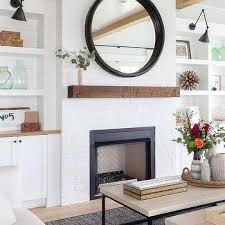 White Built Ins With Black Fireplace