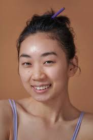 young asian woman no makeup and smiling