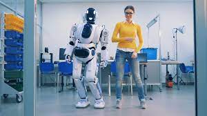 Young woman is dancing with a robot who ... | Stock Video | Pond5