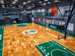 Hardwood basketball court floor viewed from above. Weiss Celtics Break Duality Of Innovation With Crown Jewel Practice Facility The Athletic