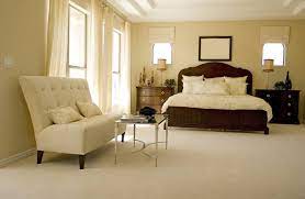 primary bedrooms with carpet flooring