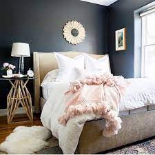 Feminine bedroom interior with a double bed with dotted sheets, armchair, art collection and plants. Dark Feminine Bedroom Chic Master Bedroom Small Master Bedroom Design Ideas Small Master Bedroom