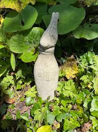 Robin On Bottle Stone Statue