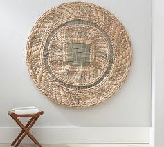 round woven disc wall art baskets on