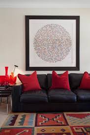 black leather sofa with red decorative
