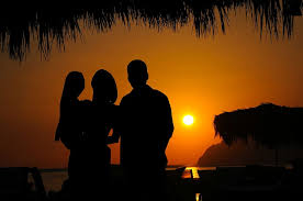 sunset backdrop beach families