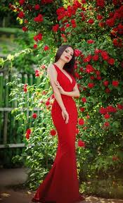 woman with makeup in red dress outdoors