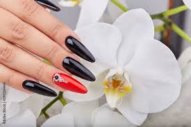 red nail polish and white orchid flower