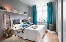 A Bedroom With Light Grey Walls And