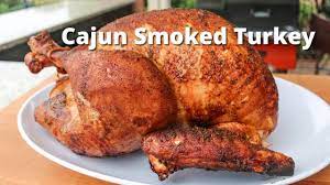 cajun smoked turkey on the grill with