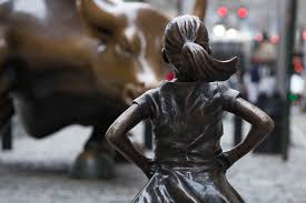 fearless girl confronts bull then