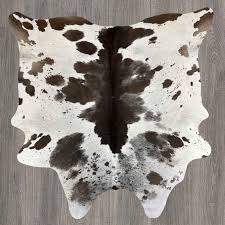 exotic chocolate white cowhide rug