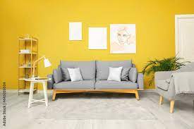 Grey Furniture And Yellow Wall