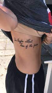 She Laughs Without Fear Of The Future Side Tattoo Rib Tattoo Rib Tattoos For Women Tattoos