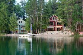 two side by side luxury lakeside homes