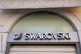 swarovski logo brand and text sign swan